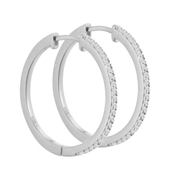 Aqua Dulce Raya Creol 925 sterling silver framstår som eleganta örhängen i silver med små klara stenar. Modell 4549-4549-1