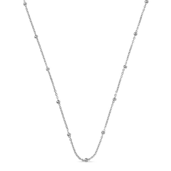 Enamel Pärlkedja Halsband i silver visat på vit bakgrund, minimalistisk design med små silverpärlor. Modell n141s-1