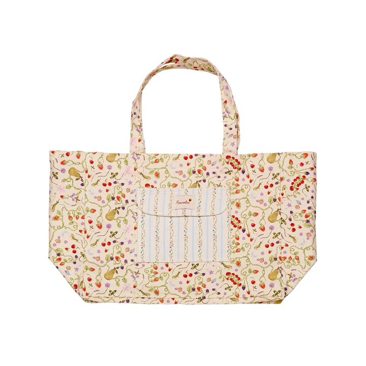 maanesten-big-canvas-tote-garden-magic-elfenben visar stor beige canvas-tote-väska med färgglatt blommönster och framficka. Modell 4122-1