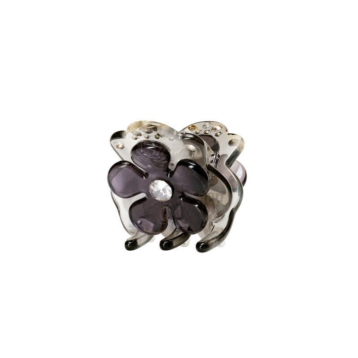 maanesten-kalina-fog-hairclaw visar en dekorativ hårspänne med lila blomma och klar sten framtill. Modell 3834