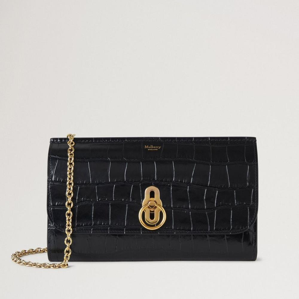 Mulberry Amberley Clutch Black Shiny Small Croc, elegant svart clutch i glänsande krokodilpräglat läder med guldkedja och vridlås. Modell RL8191641A100.