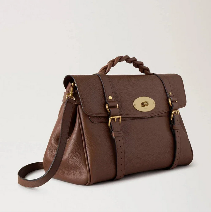 Mulberry Oversized Alexa Bright Oak Heavy Grain visar en rymlig brun läderväska med flätat handtag och gulddetaljer. Modell HH6884736G222