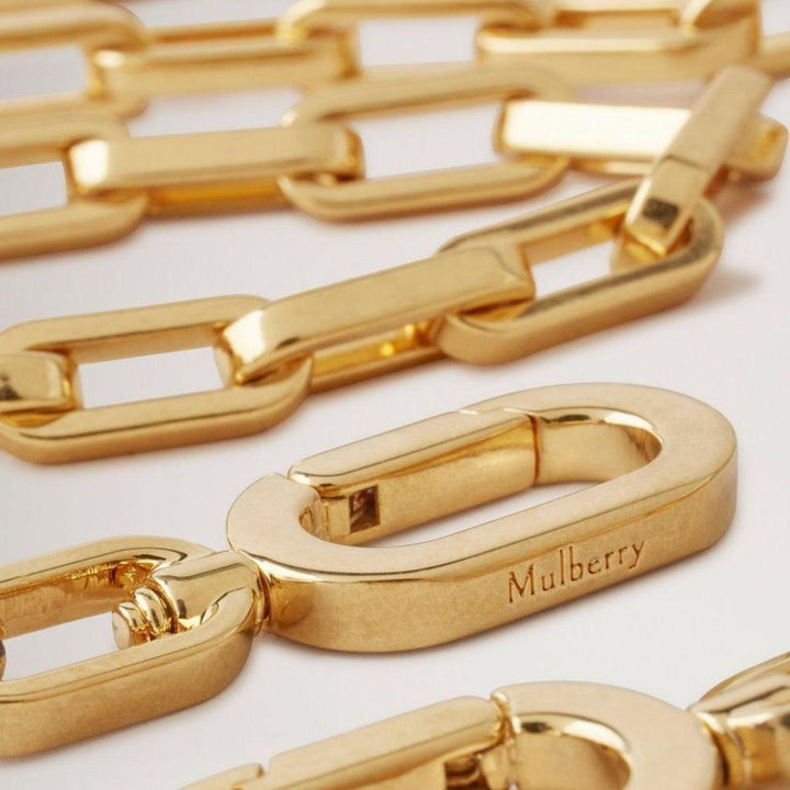 Mulberry Softie Chain Crossbody Strap med glänsande guldfärgade länkar och graverad logotyp, modell RX0289000N188.
