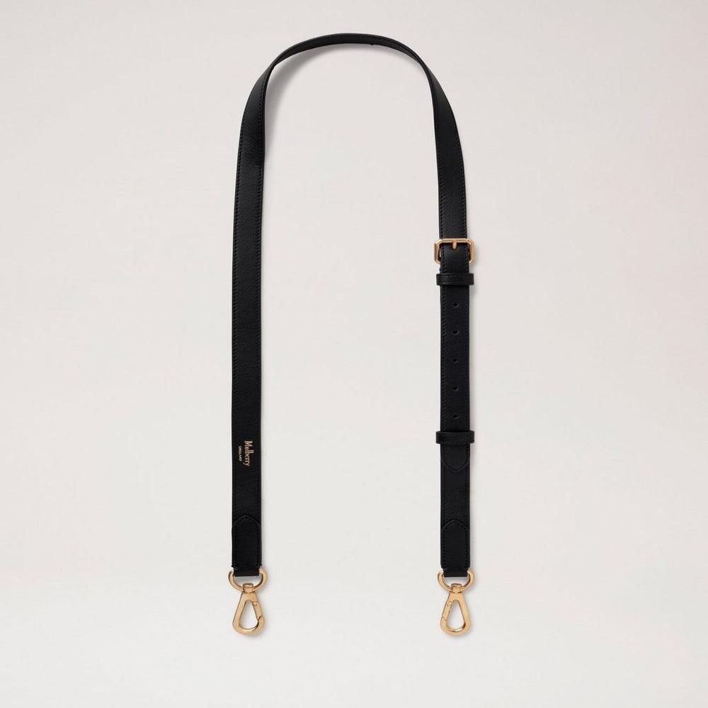 Mulberry Tunn läderrem Svart har en svart, justerbar läderrem med guldfärgade metallspännen. Modell RX0285587A100.