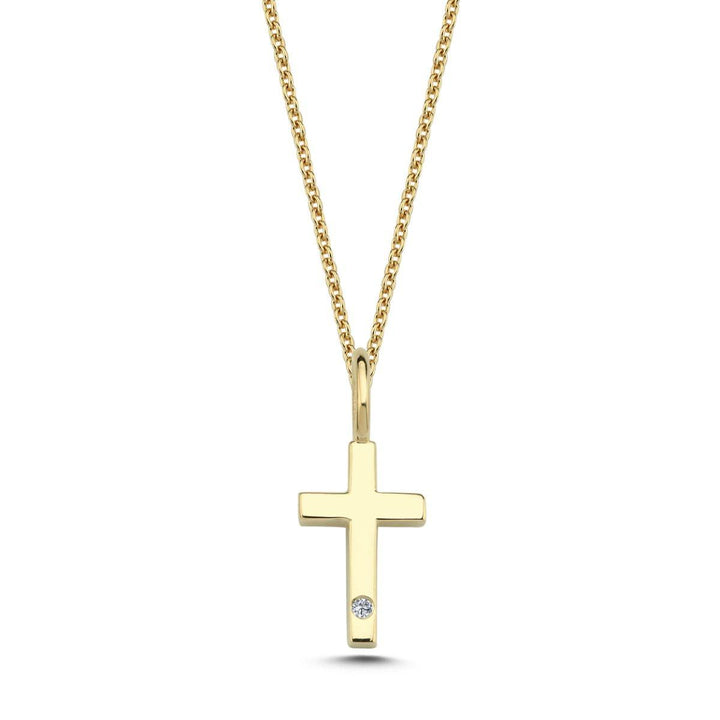 Nuran 14kt guldkors med 0,005ct W/SI visar ett enda korshänge i ljust guld med en liten diamant. Modell v2250-kors0005rg-1.