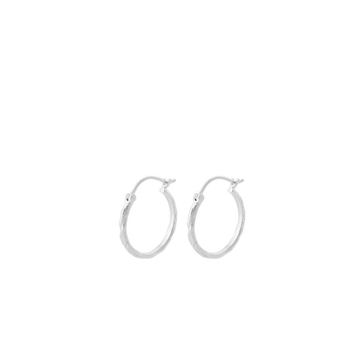 Pernille Corydon Small Ice creoles in silver, two simple round earrings on a white background. Modell E-236-S
