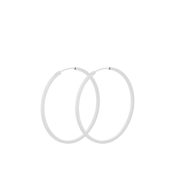 Pernille Corydon Small Orbit Hoops i silver, två enkla ringar i minimalistisk stil. Modell E-052-S-1.