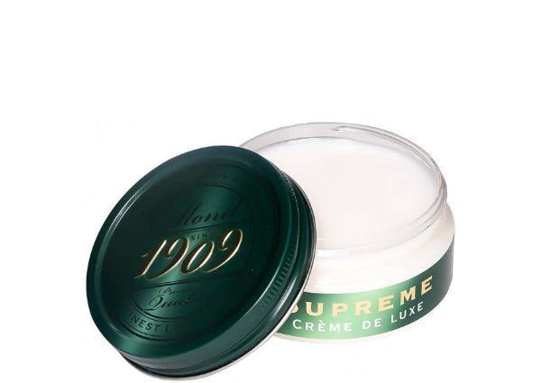 Collonil Supreme Creme Neutral visas som en rund, öppen burk med grönt lock och vit kräm. Modell 79540000050