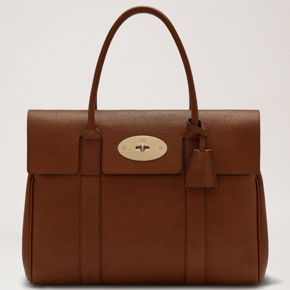Mulberry Bayswater Liten Classic Grain Oak-handväska i brunt läder med gulddetaljer. Modell HH8727552G110.